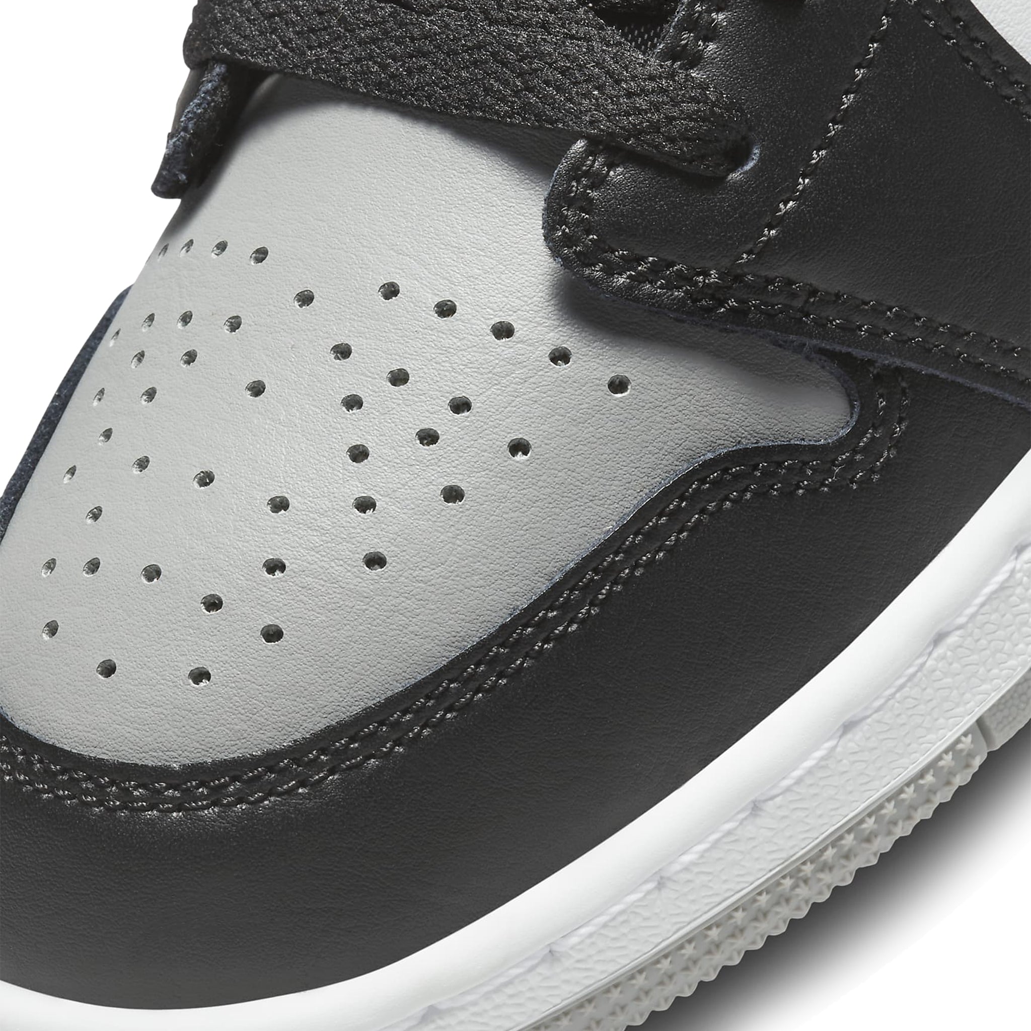 Toe box view of Air Jordan 1 Low Shadow Toe (GS) 553560-052